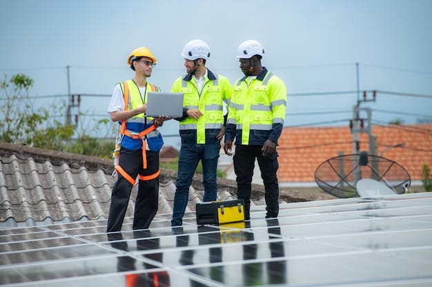 A group of diverse workers installing solar panels on a commercial building rooftop. Some are wearing safety harnesses. The sky is clear and blue.