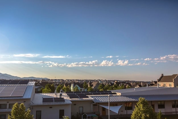 Solar panels on a rooftop in an urban setting, with a cityscape in the background. The image represents the economic growth and job creation linked to the renewable energy sector and green technologies.