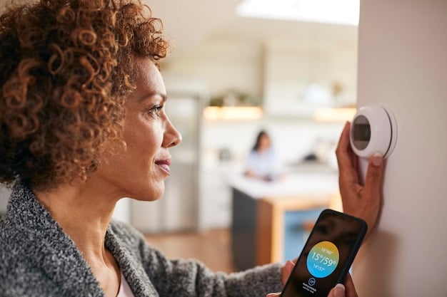 A close-up shot of a small business owner installing a smart thermostat in their office to reduce energy consumption. The focus is on the technology and the hands-on effort being made to improve energy efficiency.