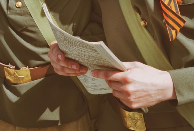 A close-up photo of the veteran's hands, holding a stack of letters and documents related to housing policy. The focus is on the determination and dedication reflected in his grip and the importance of the paperwork he's handling.