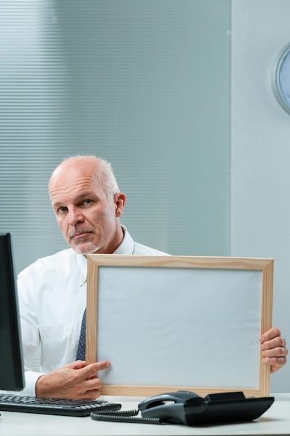 Close-up of the retired accountant pointing to a financial statement on a whiteboard, explaining the impact of different business decisions. His expression is warm and encouraging.