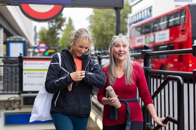 Three seniors are chatting and smiling as they wait for a bus at a bus stop. A volunteer stands nearby, offering support and assistance. The background shows a bustling town square.