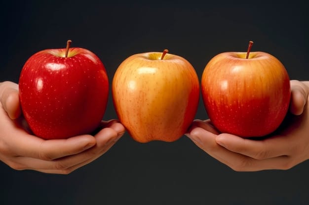 A close-up comparison shot of two apples side-by-side, one labeled 