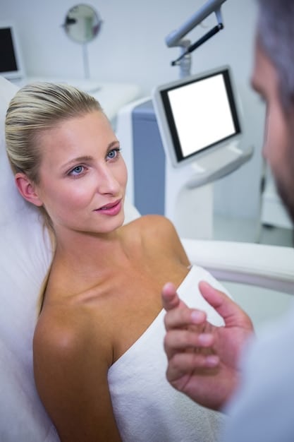 A practitioner performing Ultherapy on a patient's jawline, showcasing the device and the area being treated. Focus on the technology and precision.