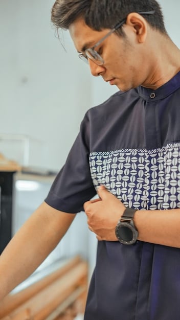 A man wearing a compression garment after gynecomastia surgery, highlighting a key component of the recovery and aftercare process for reducing swelling and supporting the healing tissue.