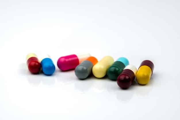 A close-up shot of various colorful anti-aging supplement capsules and tablets arranged on a clean, white surface. The supplements include different colors like red, green, white, and yellow. The lighting is bright, highlighting the textures and details of the capsules and tablets.