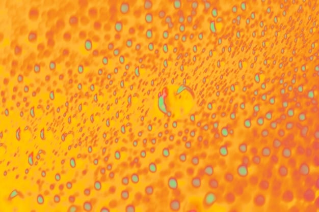 Microscopic view of skin cells showing melanin deposits that cause age spots. The image also highlights the presence of Vitamin C molecules counteracting the melanin production.