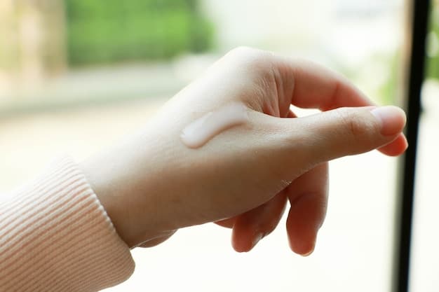 A close-up shot of a person's hand applying a thick, rich moisturizer to their forearm. The texture of the cream is clearly visible, and the skin appears hydrated and healthy.