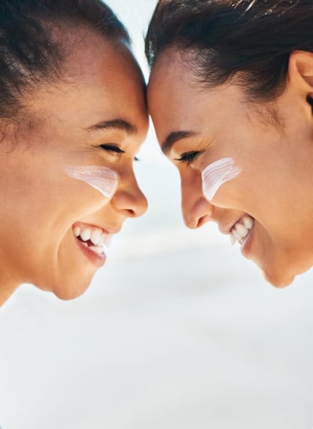 A side-by-side comparison of a person with sensitive skin applying mineral sunscreen and a person with oily skin applying chemical sunscreen. The image should highlight the different textures and application experiences.