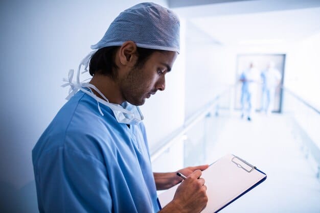 A surgeon and patient reviewing a consent form, emphasizing the importance of understanding risks and benefits before surgery.