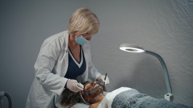 A dermatologist wearing gloves and protective glasses, carefully applying a handheld laser device to a patient's forehead, focusing on fine lines. The patient appears comfortable.