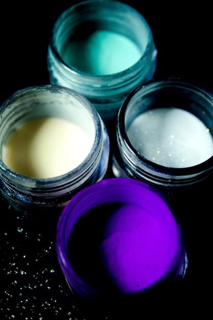 A close-up of a diverse group of skincare bottles and jars, with one open to reveal the texture of a cream, symbolizing a curated and informed collection of products.