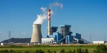 Modern coal power plant with emission controls against clear sky