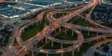 Decoding the Infrastructure Bill's Impact on US Economic Growth by 2026 Modern highway interchange symbolizing US infrastructure investment
